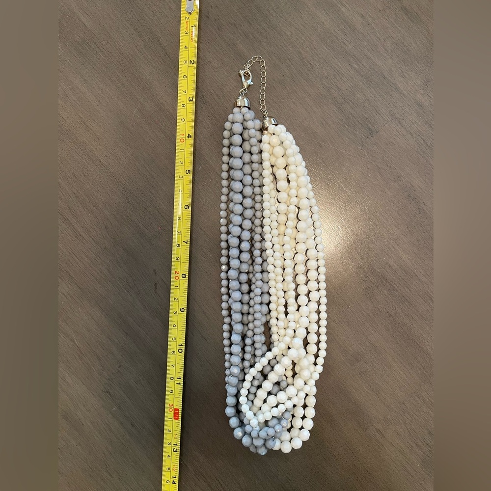 Very interesting white and grey statement necklace